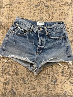 AGOLDE High-Rise Frayed Hem Denim Shorts in Blue - size 24 - organic cotton